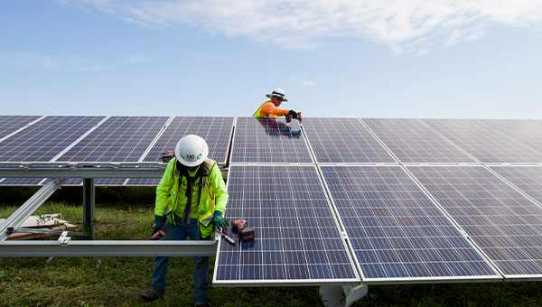 FPL employees working on solar panels