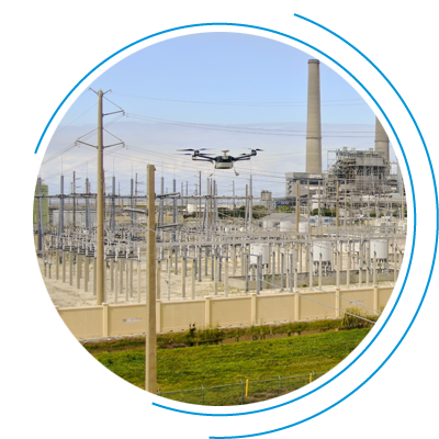 drones flying over power plant