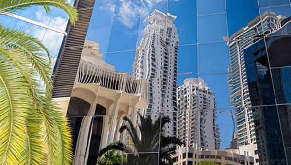 Reflection of modern skyscrapers on the glass of another in Florida.