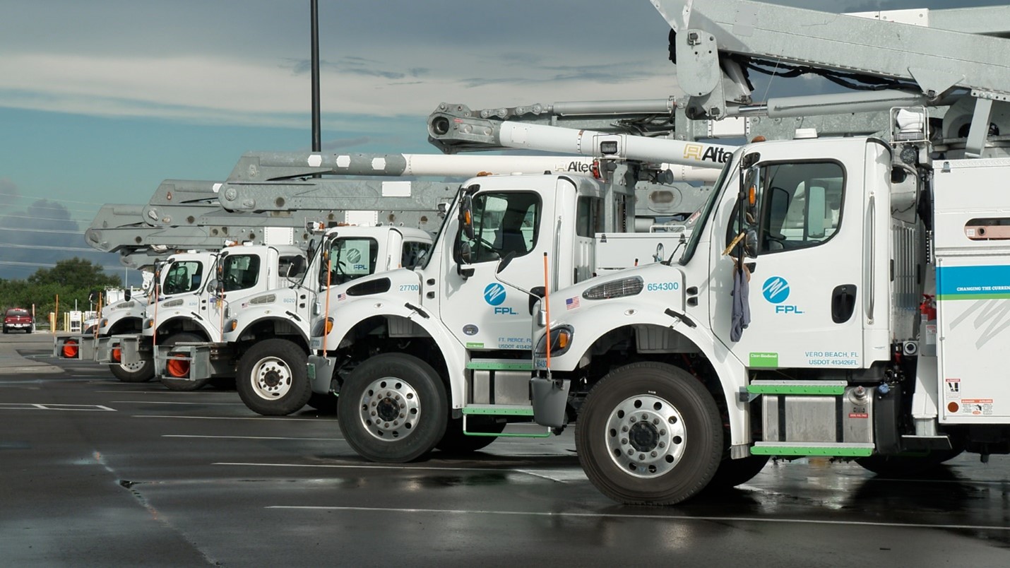 image of bucket trucks parked in a row