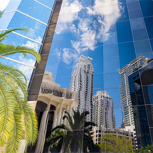 reflection of buildings in a skyscraper 